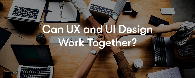 Can UX and UI Design Work Together? text in front of people leaning on a desk putting their hands on top of one another's with laptops on the desk