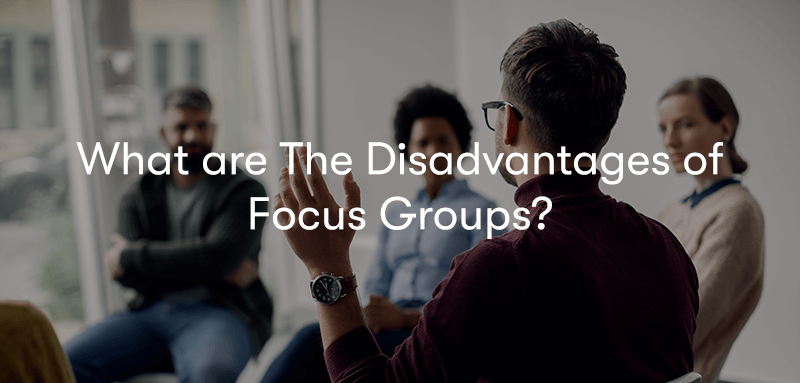 people sat in a circle having a discussion with the words what are the disadvantages of focus groups? in front