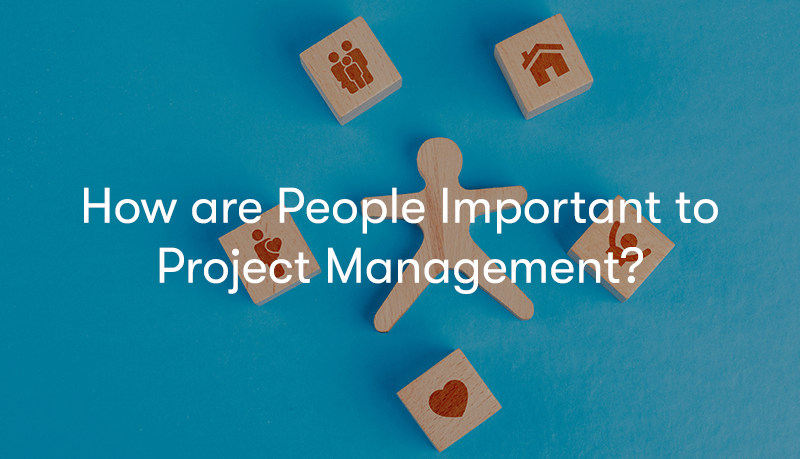 How are People Important to Project Management? text in front of a man surrounded by business elements on wooden blocks