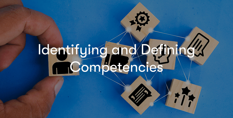 Hand moving block around that have competencies and people on them with the text Identifying and Defining Competencies in front