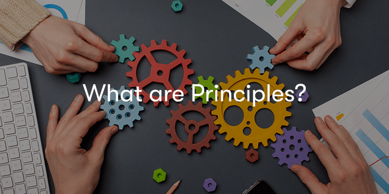 'What are Principles?' text in front of people moving cogs around on a desk