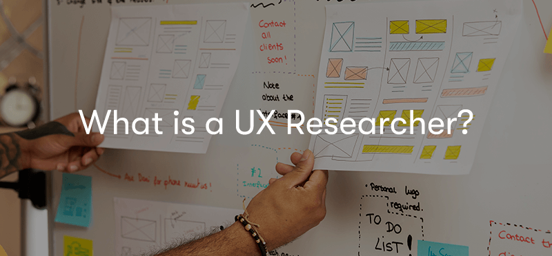 What is a UX researcher? text in front of a UX research board