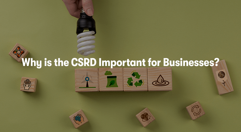 A picture of wooden blocks with sustainability elements on them, like recycling, green energy, wind turbines, water, ect. With the heading 'Why is the CSRD Important for Businesses?' in front. On a green background.