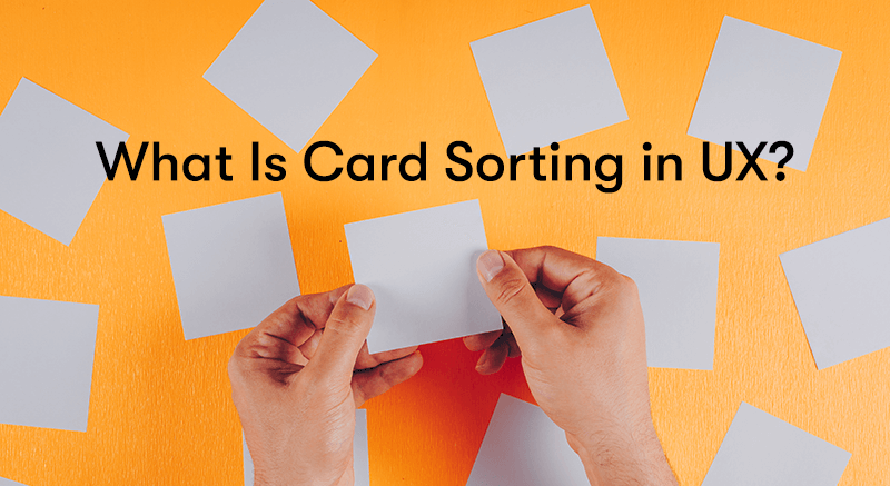 What is Card Sorting in UX text in front of hand moving post-it notes around
