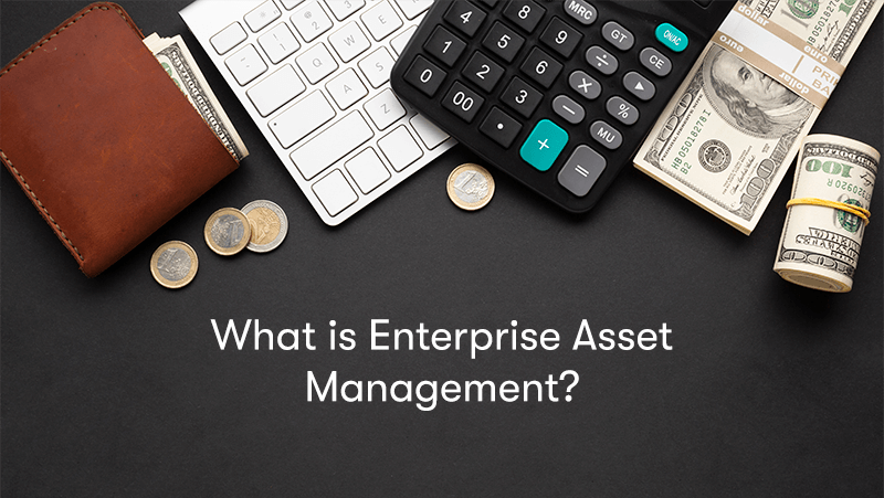 A picture of a wallet, money, calculator, and computer on a desk, with the words What is Enterprise Asset Management? Below. With a grey background.